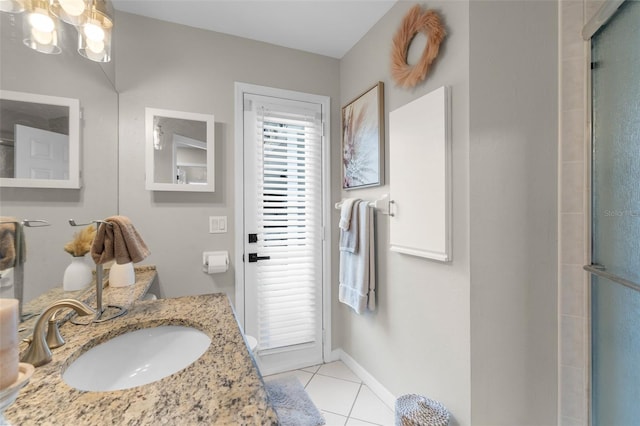bathroom with tile patterned flooring, an enclosed shower, a chandelier, baseboards, and vanity