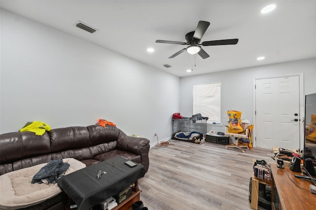 4737 6th St, Zephyrhills, FL 33542 - living room featuring light wood-style flooring, recessed lighting, a ceiling fan, and baseboards