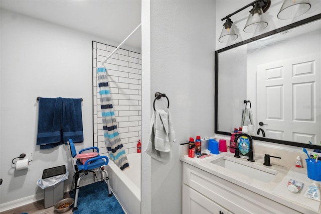 4737 6th St, Zephyrhills, FL 33542 - full bath featuring vanity, shower / bathtub combination with curtain, and baseboards