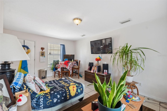 4737 6th St, Zephyrhills, FL 33542 - bedroom with tile patterned floors and baseboards