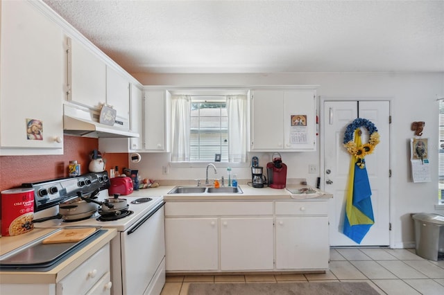 4737 6th St, Zephyrhills, FL 33542 - kitchen featuring a sink, under cabinet range hood, white electric range, light countertops, and white cabinets