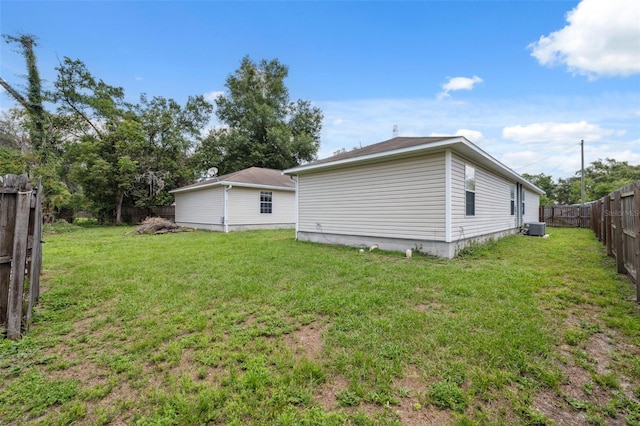 4737 6th St, Zephyrhills, FL 33542 - back of house with central AC