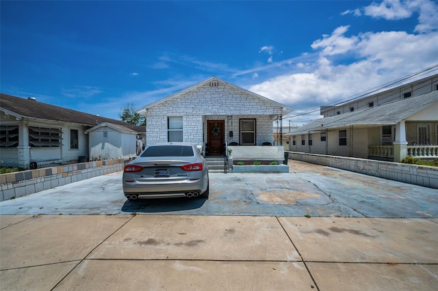 124 Athens St, Tarpon Springs, FL 34689 - view of front of home featuring stone siding