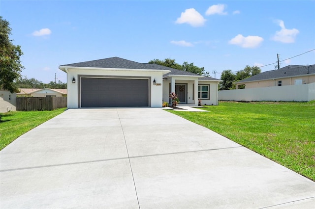 5328 Baldock Ave, Spring Hill, FL 34608 - view of front of home featuring driveway, an attached garage, and stucco siding