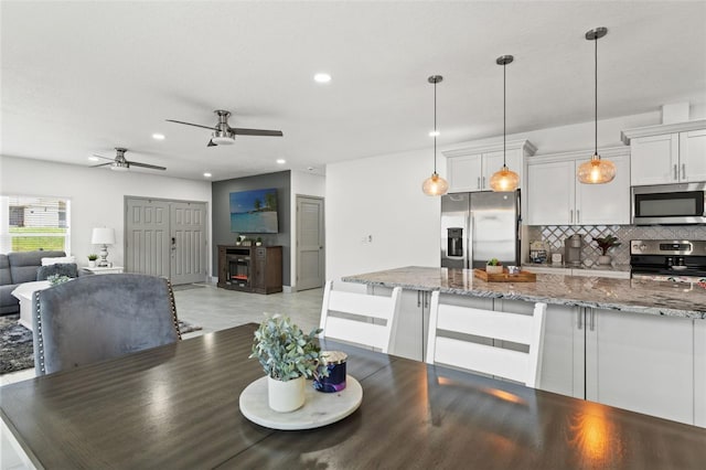 5328 Baldock Ave, Spring Hill, FL 34608 - dining area featuring a ceiling fan and recessed lighting