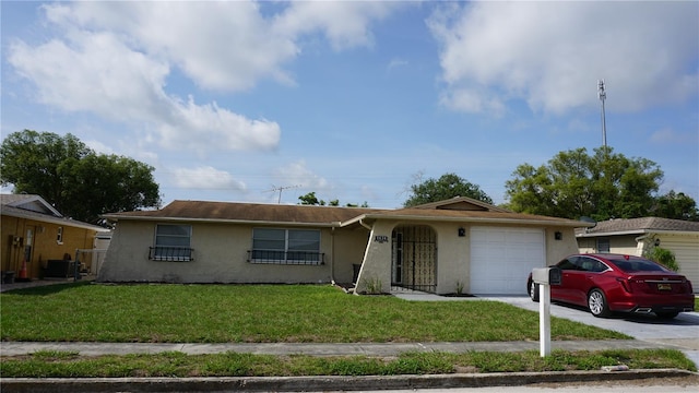 5636 Dolores Dr, Holiday, FL 34690 - ranch-style house featuring an attached garage, stucco siding, driveway, a front lawn, and cooling unit