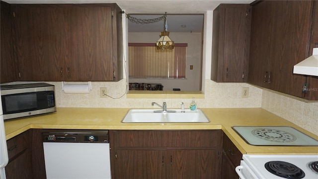 5636 Dolores Dr, Holiday, FL 34690 - kitchen with white appliances, a sink, light countertops, premium range hood, and tasteful backsplash
