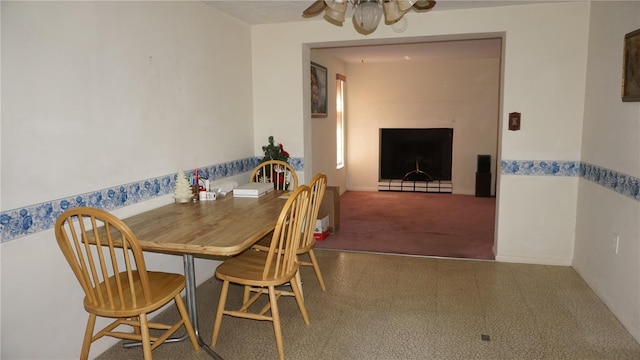 5636 Dolores Dr, Holiday, FL 34690 - dining space featuring ceiling fan, carpet, and a baseboard radiator