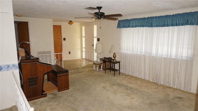 5636 Dolores Dr, Holiday, FL 34690 - unfurnished room with ceiling fan, carpet floors, and a textured ceiling