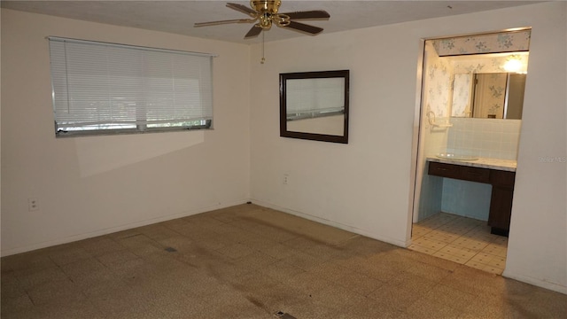 5636 Dolores Dr, Holiday, FL 34690 - spare room with a ceiling fan, light flooring, and baseboards