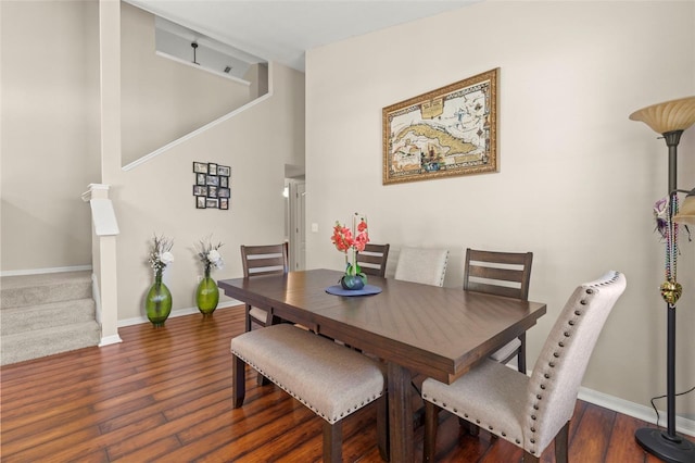 12055 Colony Lakes Blvd, New Port Richey, FL 34654 - dining area with stairs, wood finished floors, and baseboards