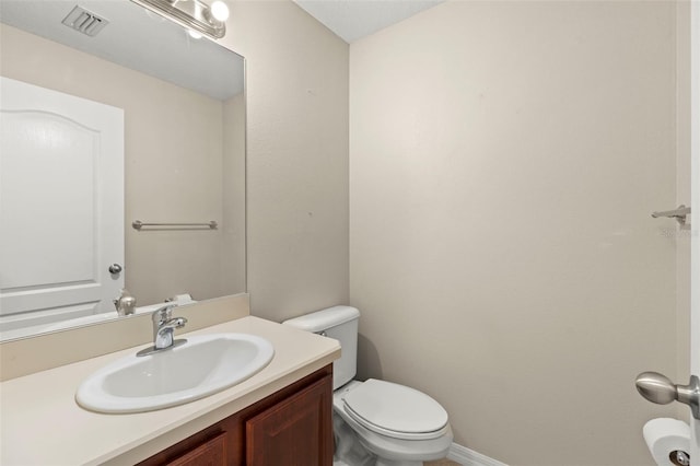 12055 Colony Lakes Blvd, New Port Richey, FL 34654 - bathroom featuring toilet, vanity, and baseboards