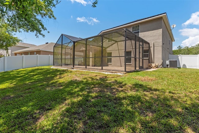 12055 Colony Lakes Blvd, New Port Richey, FL 34654 - back of house with stucco siding, central air condition unit, and a lanai