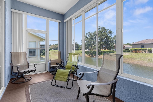 9407 Burnam Dr, Weeki Wachee, FL 34613 - sunroom / solarium with wood finished floors and a water view