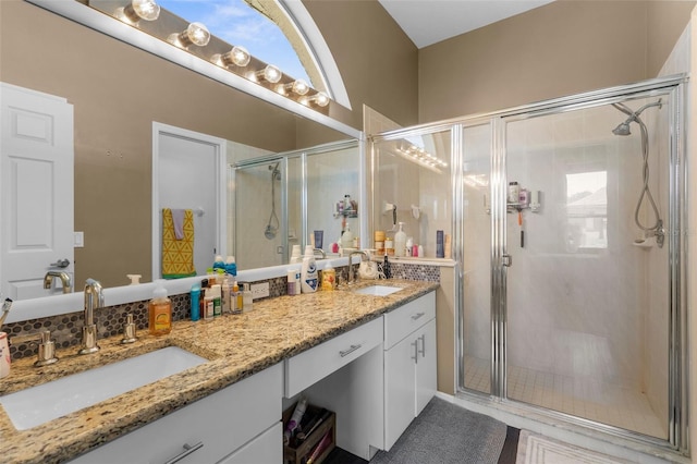 9407 Burnam Dr, Weeki Wachee, FL 34613 - bathroom featuring double vanity and a shower stall