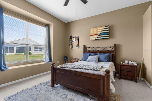 9407 Burnam Dr, Weeki Wachee, FL 34613 - bedroom featuring light colored carpet, baseboards, and a ceiling fan