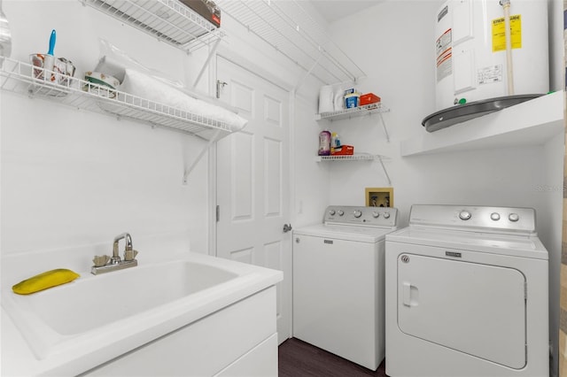 9407 Burnam Dr, Weeki Wachee, FL 34613 - laundry area featuring water heater and separate washer and dryer