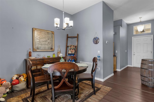 9407 Burnam Dr, Weeki Wachee, FL 34613 - dining room featuring a chandelier, baseboards, and dark wood-style floors