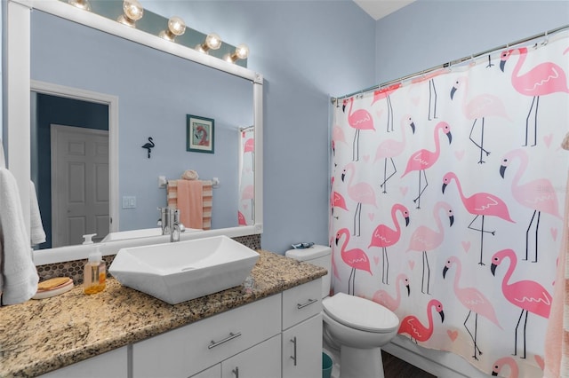 9407 Burnam Dr, Weeki Wachee, FL 34613 - full bath featuring vanity, toilet, and a shower with shower curtain