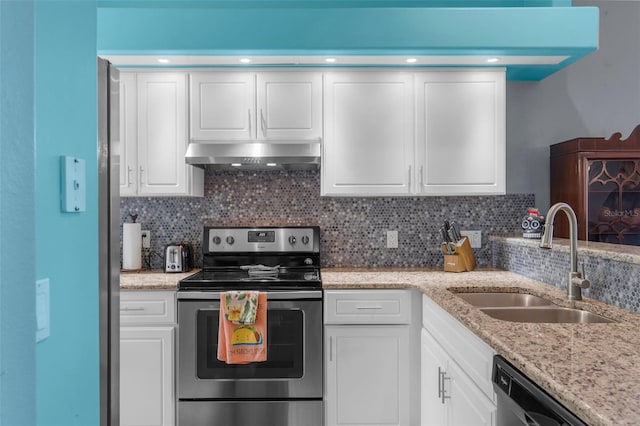 9407 Burnam Dr, Weeki Wachee, FL 34613 - kitchen with electric stove, under cabinet range hood, a sink, dishwasher, and white cabinetry