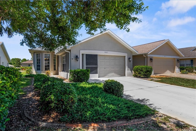 9407 Burnam Dr, Weeki Wachee, FL 34613 - ranch-style house with an attached garage, stucco siding, and driveway