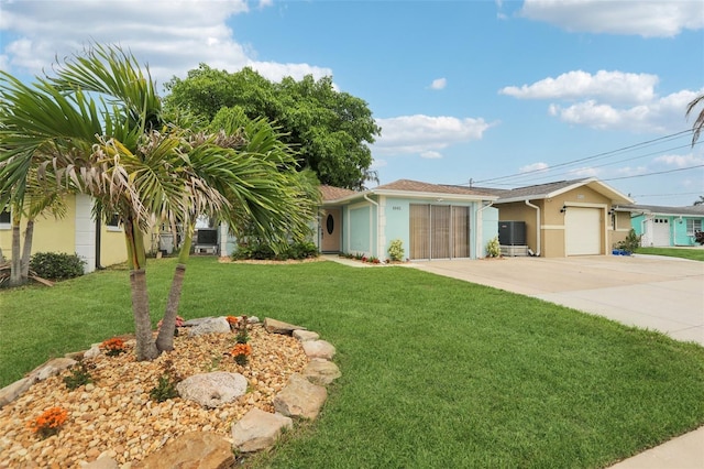 4942 Blue Heron Dr, New Port Richey, FL 34652 - single story home with driveway, stucco siding, a front yard, and an attached garage