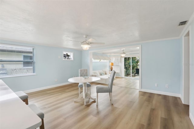 4942 Blue Heron Dr, New Port Richey, FL 34652 - dining space with baseboards, wood finished floors, and ceiling fan