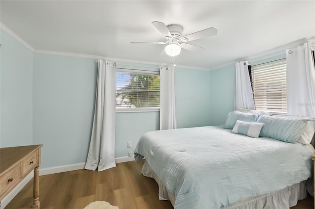 4942 Blue Heron Dr, New Port Richey, FL 34652 - bedroom with wood finished floors, baseboards, ornamental molding, and a ceiling fan