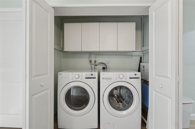 4942 Blue Heron Dr, New Port Richey, FL 34652 - laundry area featuring cabinet space and independent washer and dryer