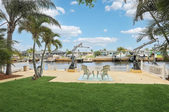 4942 Blue Heron Dr, New Port Richey, FL 34652 - dock featuring a water view, a residential view, and a patio area