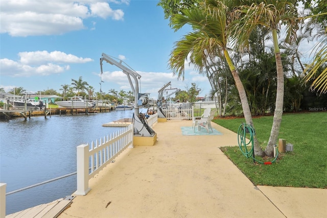 4942 Blue Heron Dr, New Port Richey, FL 34652 - dock featuring a water view and a patio area