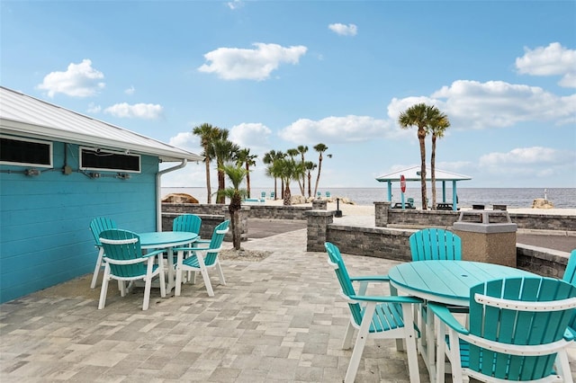 4942 Blue Heron Dr, New Port Richey, FL 34652 - view of patio with outdoor dining area and a water view