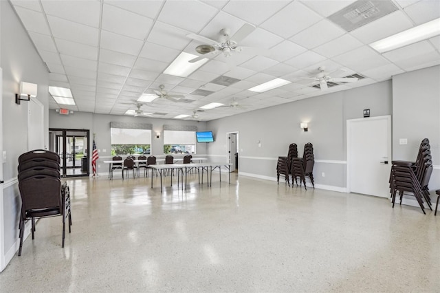 4942 Blue Heron Dr, New Port Richey, FL 34652 - misc room with ceiling fan, speckle patterned floor, a paneled ceiling, and baseboards