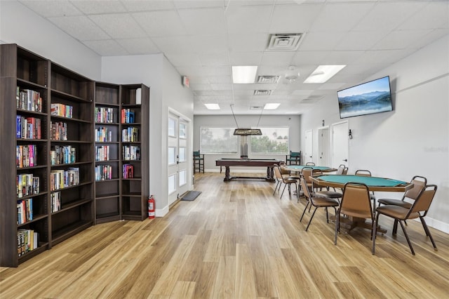 4942 Blue Heron Dr, New Port Richey, FL 34652 - game room featuring light wood-type flooring, billiards table, a paneled ceiling, and baseboards