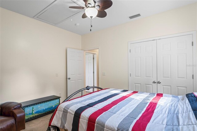 15613 Charmwood Dr, Hudson, FL 34667 - carpeted bedroom with attic access, a closet, and ceiling fan