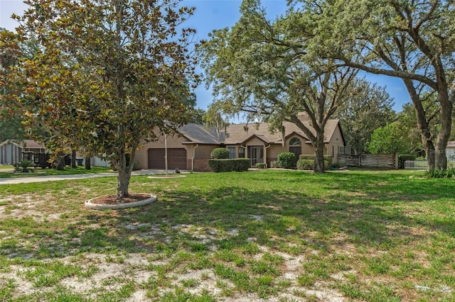 8402 Lake Hill Ct, Spring Hill, FL 34608 - view of front of home with an attached garage and driveway