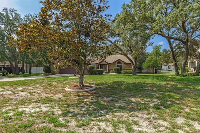 8402 Lake Hill Ct, Spring Hill, FL 34608 - view of front of home with driveway and a garage