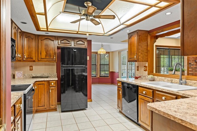 8402 Lake Hill Ct, Spring Hill, FL 34608 - kitchen featuring black appliances, a sink, a raised ceiling, light tile patterned floors, and backsplash