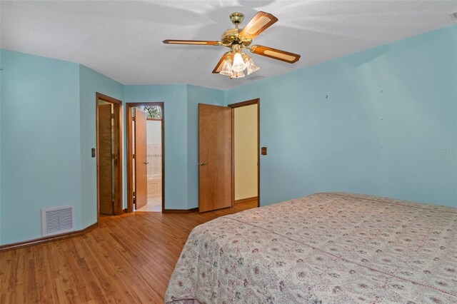 8402 Lake Hill Ct, Spring Hill, FL 34608 - bedroom featuring wood finished floors, baseboards, and ceiling fan