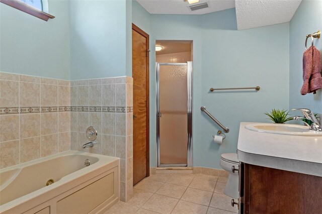 8402 Lake Hill Ct, Spring Hill, FL 34608 - bathroom with a tub with jets, tile patterned floors, a shower stall, vanity, and toilet