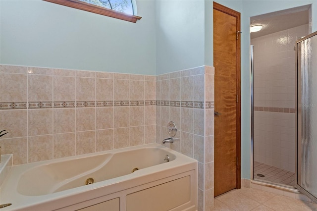 8402 Lake Hill Ct, Spring Hill, FL 34608 - full bath with a jetted tub, a shower stall, and tile patterned flooring