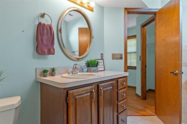 8402 Lake Hill Ct, Spring Hill, FL 34608 - bathroom featuring vanity and toilet
