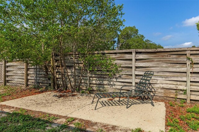 8402 Lake Hill Ct, Spring Hill, FL 34608 - fenced backyard with a patio