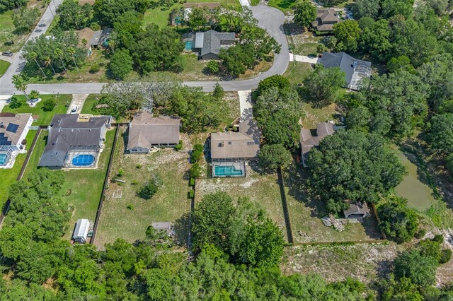 8402 Lake Hill Ct, Spring Hill, FL 34608 - aerial view of property and surrounding area featuring a pool area and nearby suburban area