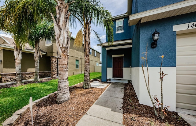 14008 Lugano Ct, Hudson, FL 34669 - doorway to property featuring stucco siding