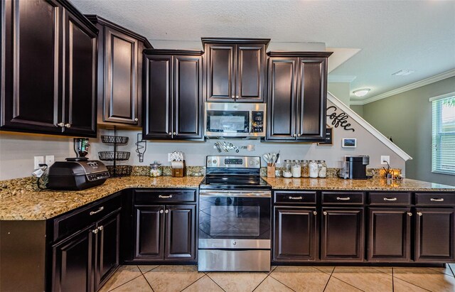 14008 Lugano Ct, Hudson, FL 34669 - kitchen with stainless steel appliances, light tile patterned floors, light stone countertops, ornamental molding, and a peninsula