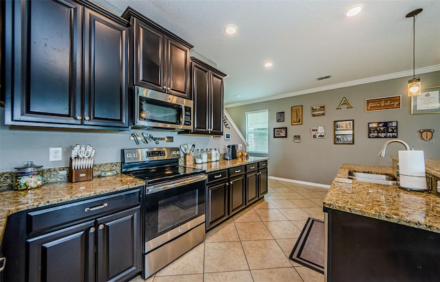 14008 Lugano Ct, Hudson, FL 34669 - kitchen featuring appliances with stainless steel finishes, a sink, crown molding, light tile patterned flooring, and hanging light fixtures