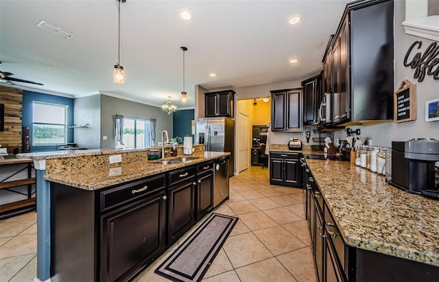 14008 Lugano Ct, Hudson, FL 34669 - kitchen with a sink, hanging light fixtures, light tile patterned floors, light stone countertops, and ornamental molding