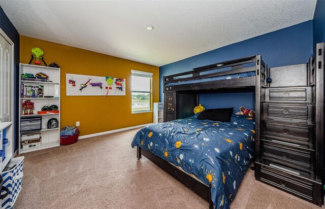 14008 Lugano Ct, Hudson, FL 34669 - carpeted bedroom with a textured ceiling and baseboards