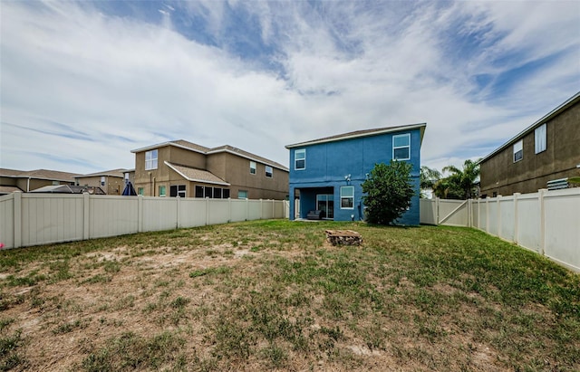 14008 Lugano Ct, Hudson, FL 34669 - back of house featuring an outdoor fire pit